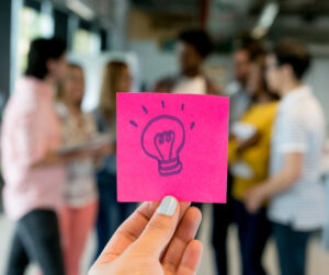 sticky note with a light bulb